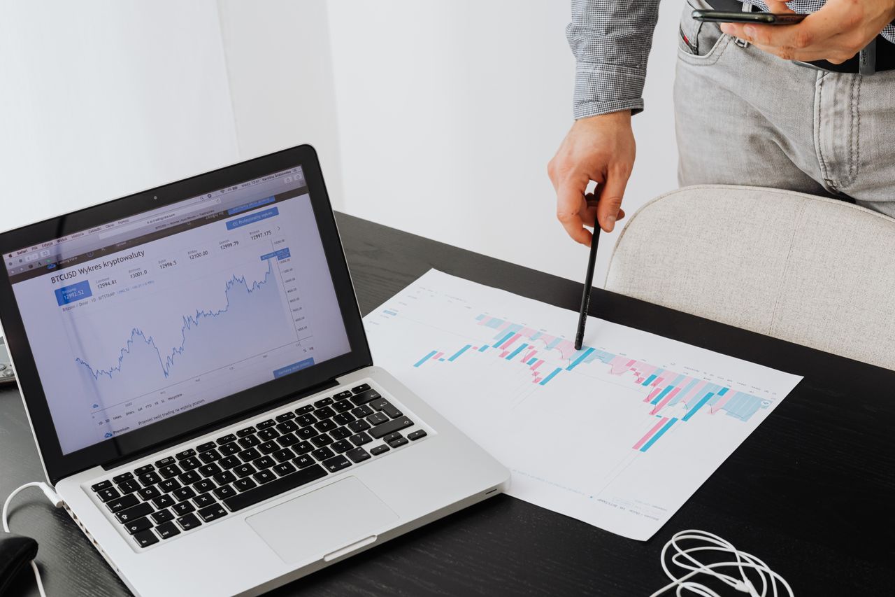gallery-2 Person analyzing cryptocurrency data using a laptop, highlighting financial insights.